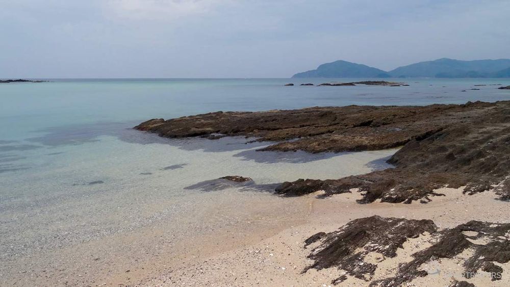 The sand is fine and pink tinted.